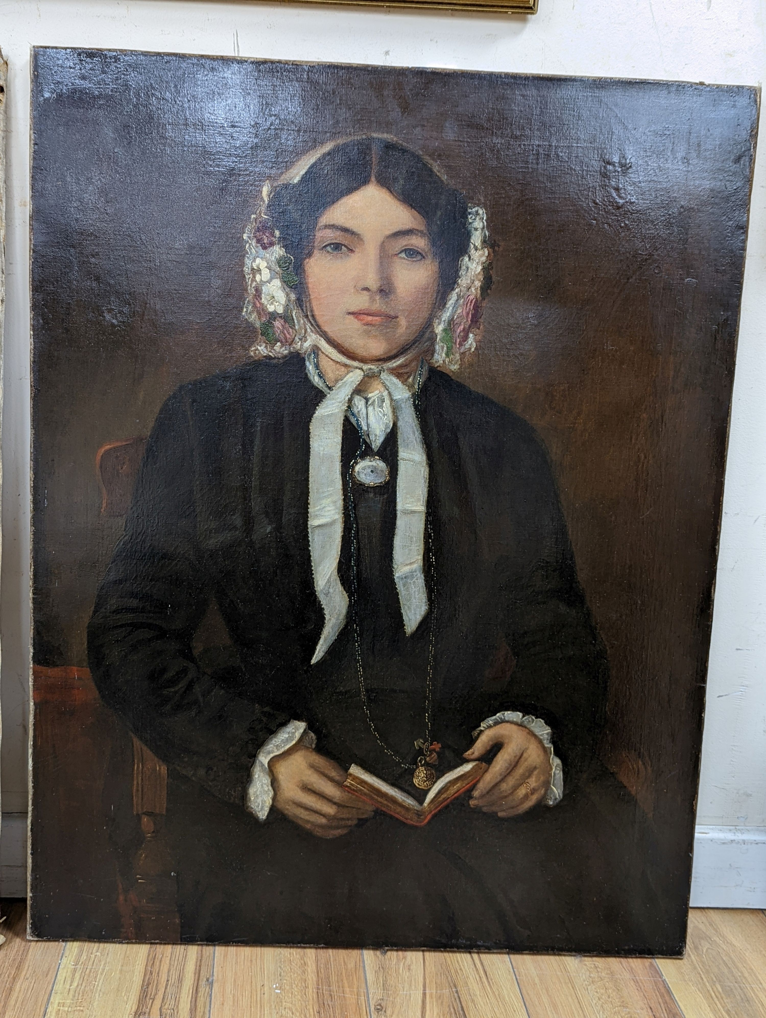 Victorian School, oil on canvas, Portrait of a young lady holding book, 92 x 71cm, unframed